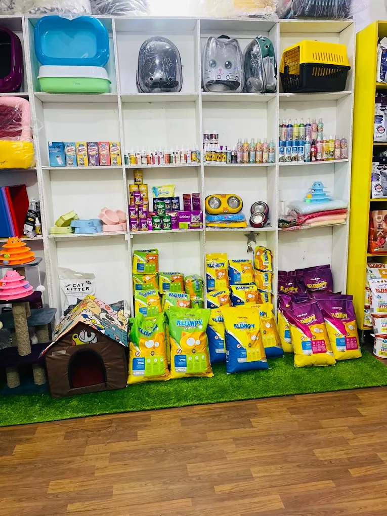 Pet Mart shelves stacked with cat litter, carriers, toys and dry food